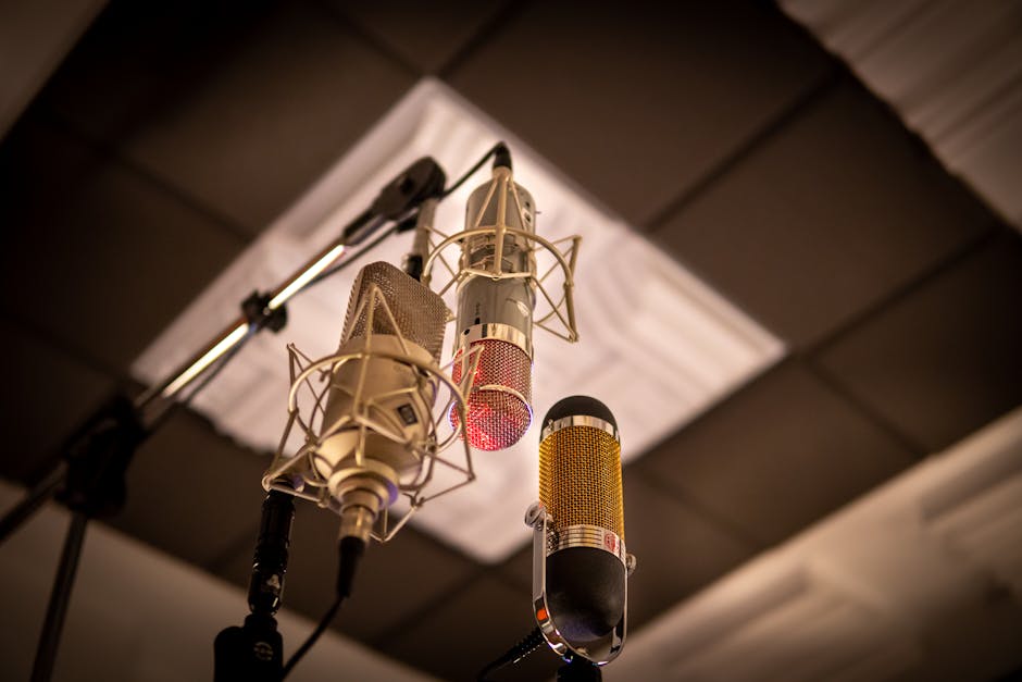 Three condenser microphones arranged for optimal sound capture in a recording studio.